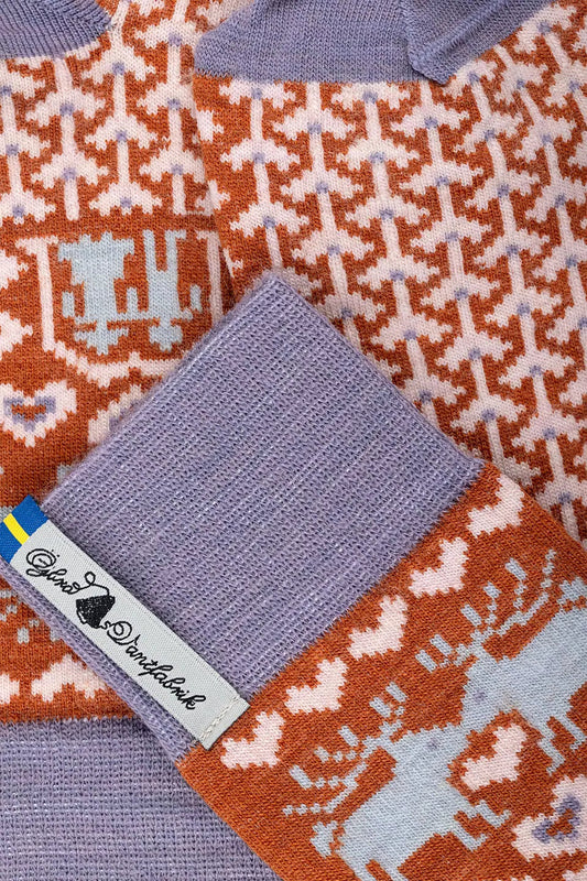 Ojbro Vantfabrik made in Sweden merino wool sooks in Fasfolk couples design in brick red and lilac.