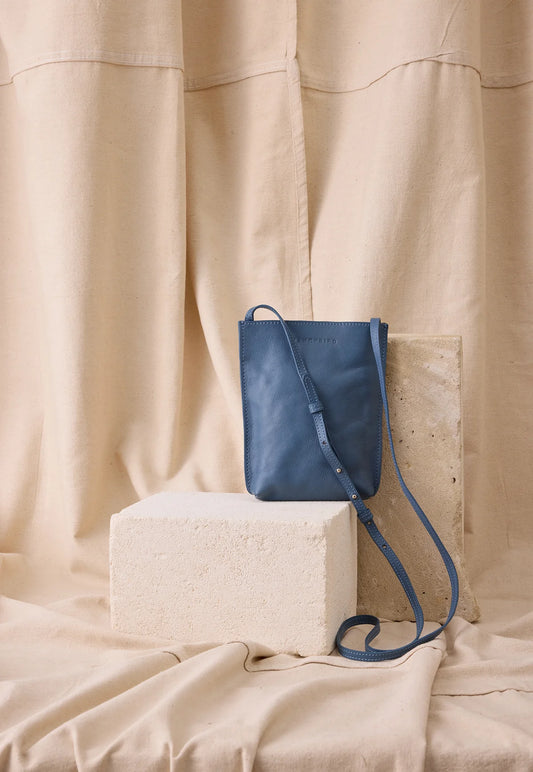 Nancybird Louanne pouch in vegetable tanned leather cross body mineral blue.