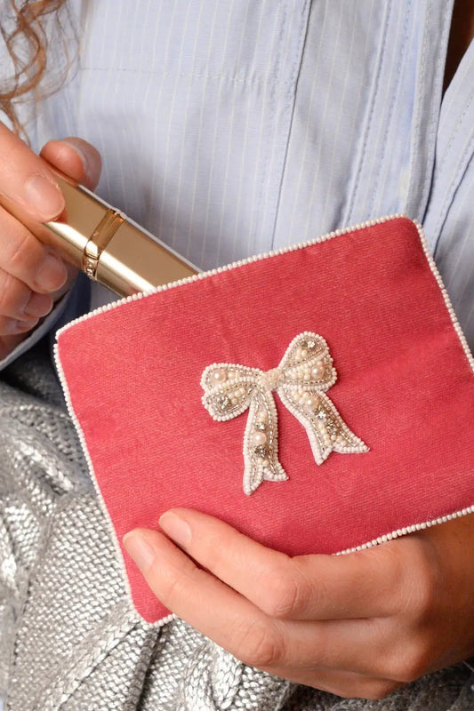 My Doris pink velvet zippered beaded bow pouch.