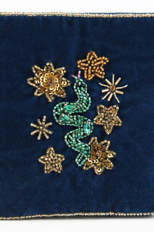 My Doris velvet pouch featuring hand beaded snake and stars on navy blue.