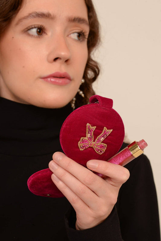 My Doris pink bow velvet compact mirror.
