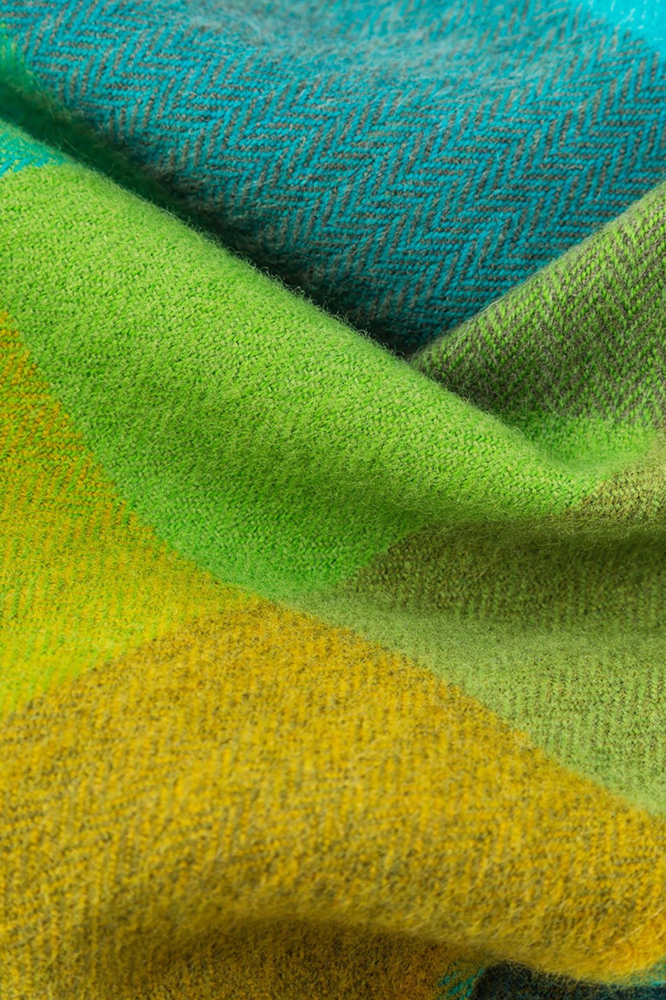 Avoca the Mill made in Ireland merino wool scarf in green fields, green checks with bright blue contrast.