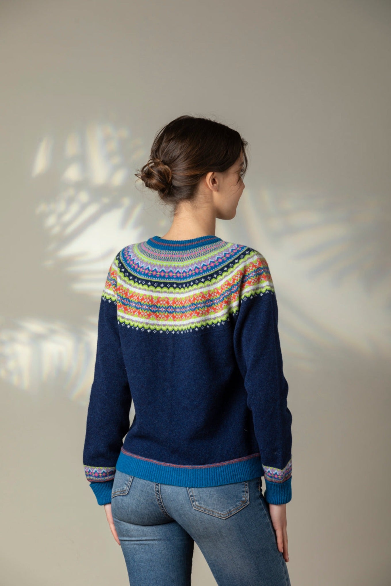 Eribe Scottish fairisle Alpine short cropped cardigan in Aurora, navy with fairisle in lime green, pink, orange and lavender fairisle.