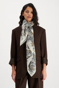 Inoui  Editions wool square scarf featuring map of Central Park New York with dogs, black and latte on wool white.