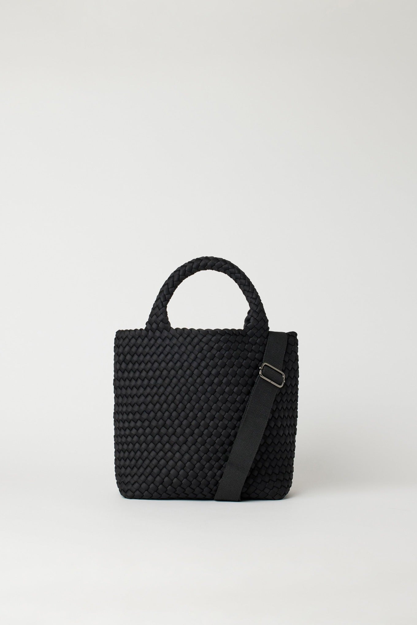 Andreina Ciudad crossbody handwoven fabric tote bag in black.