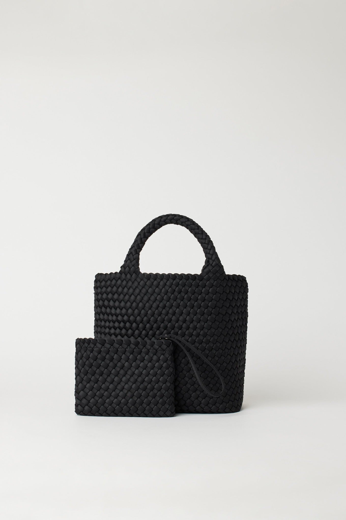Andreina Ciudad crossbody handwoven fabric tote bag in black.