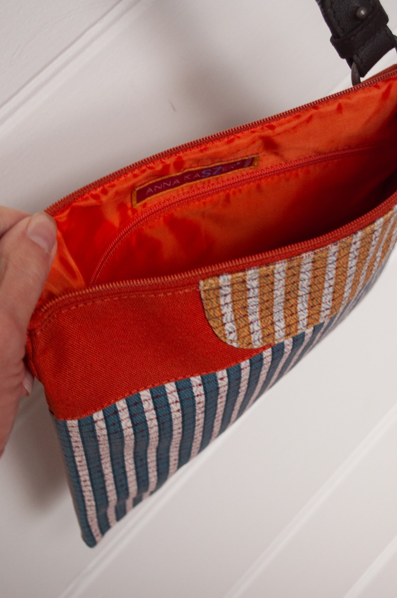 Anna Kaszer cotton canvas Rola mini crossbody bag in aqua and orange.