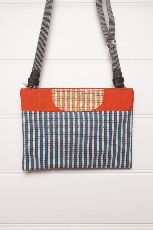 Anna Kaszer cotton canvas Rola mini crossbody bag in aqua and orange.