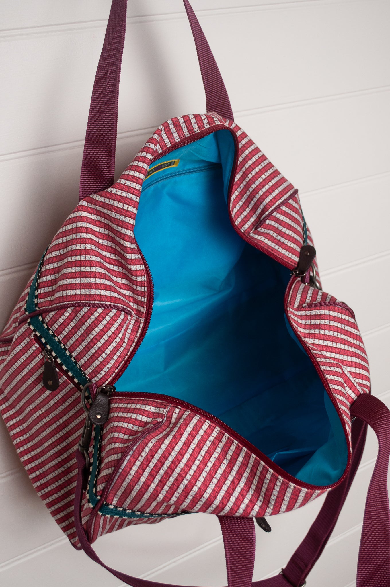 Anna Kaszer Helzip cotton canvas weekend duffle bag in red stripe.