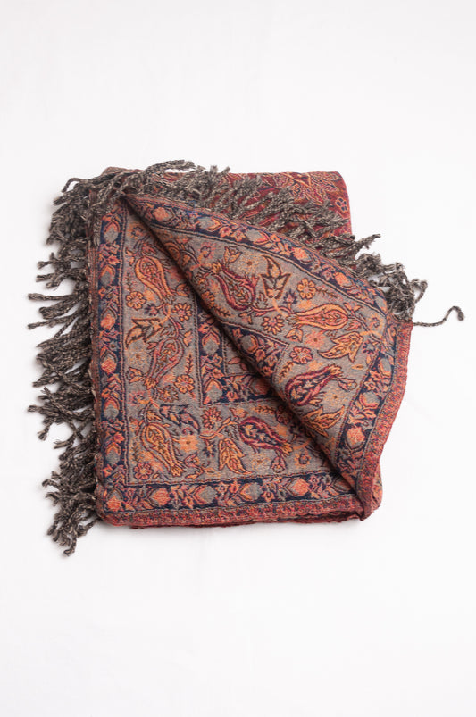 Tasseled wool throw - magenta paisley