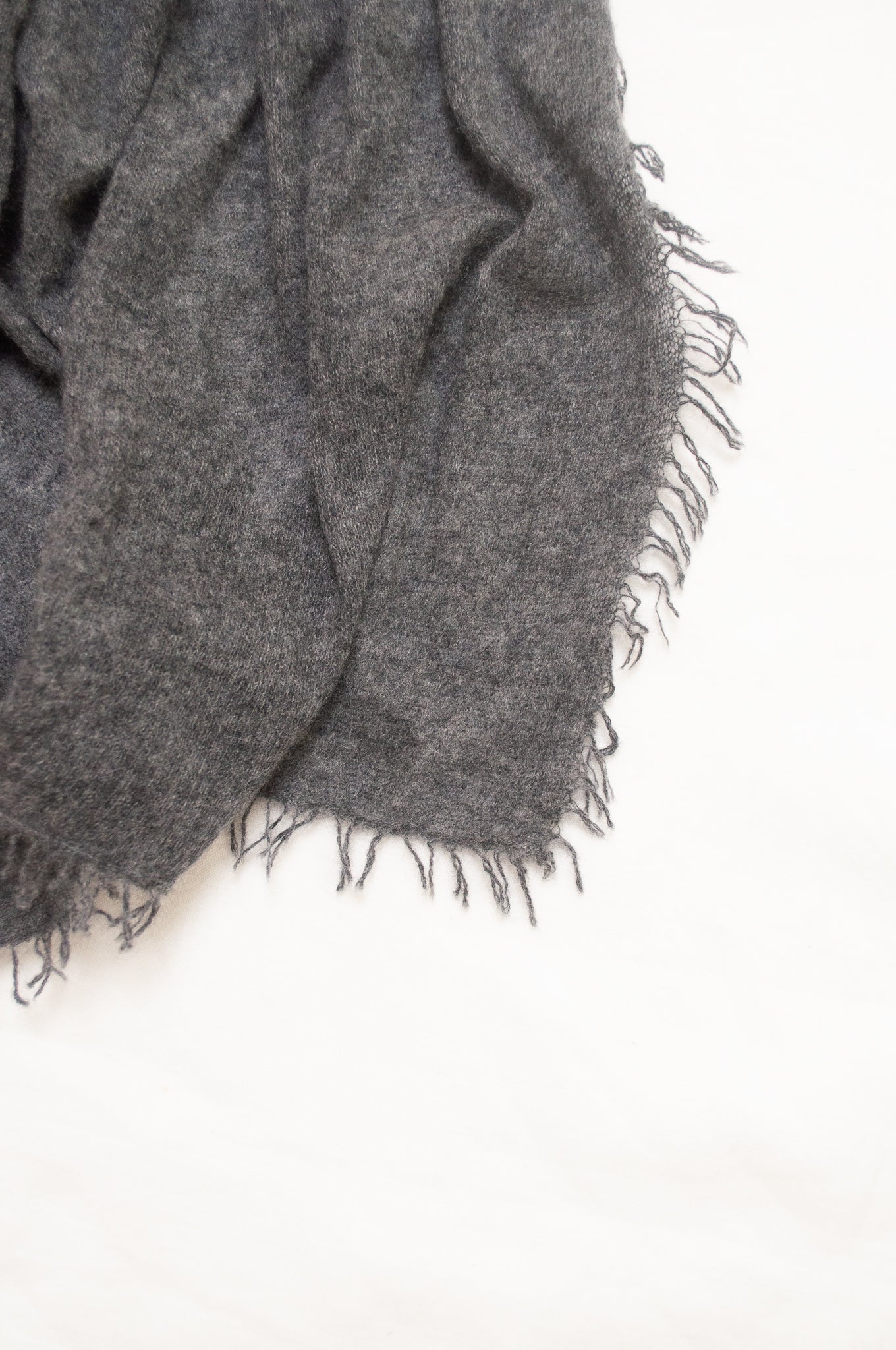 Pure cashmere, lightweight knit fringed scarf in charcoal grey.