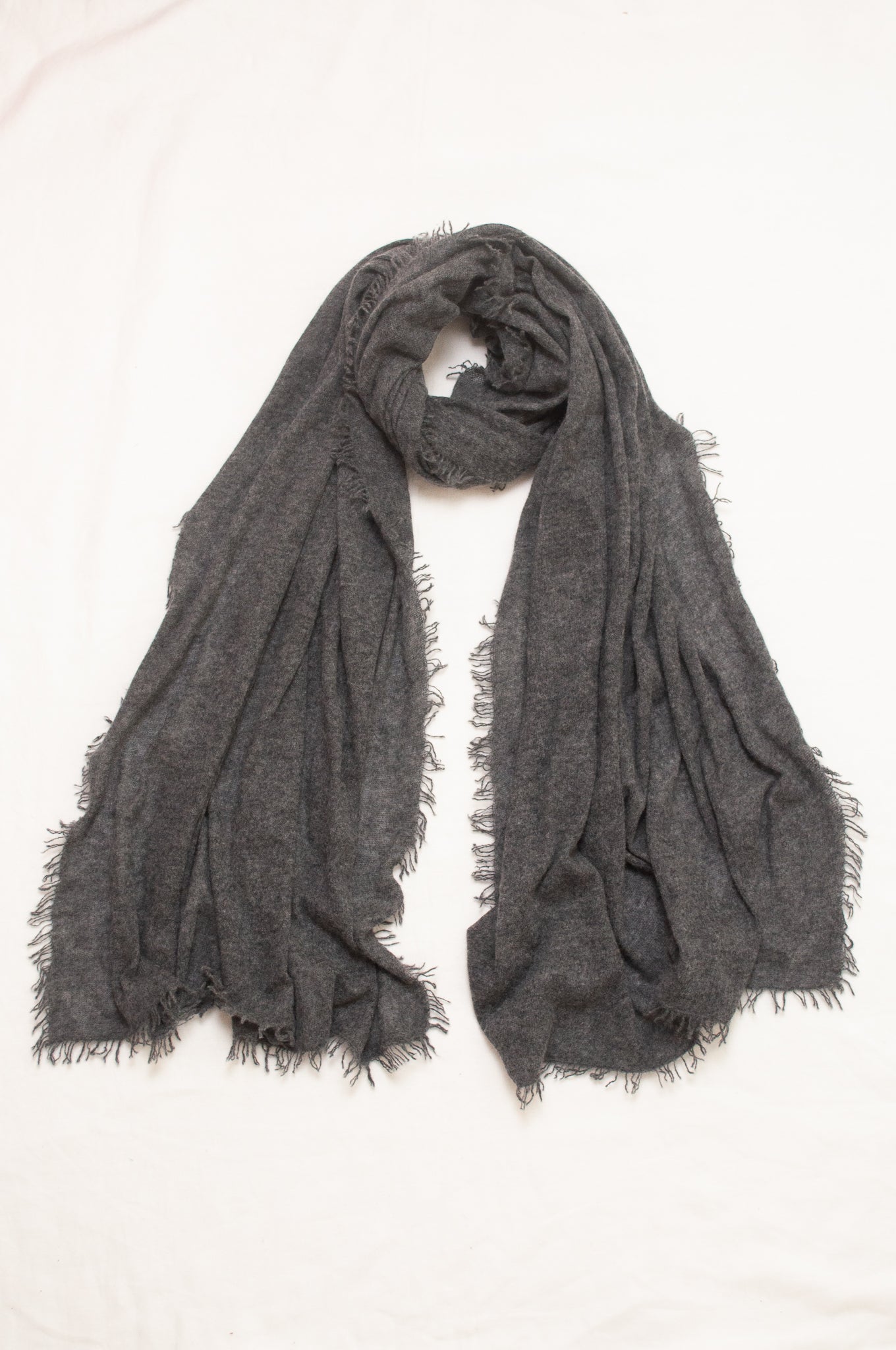 Pure cashmere, lightweight knit fringed scarf in charcoal grey.