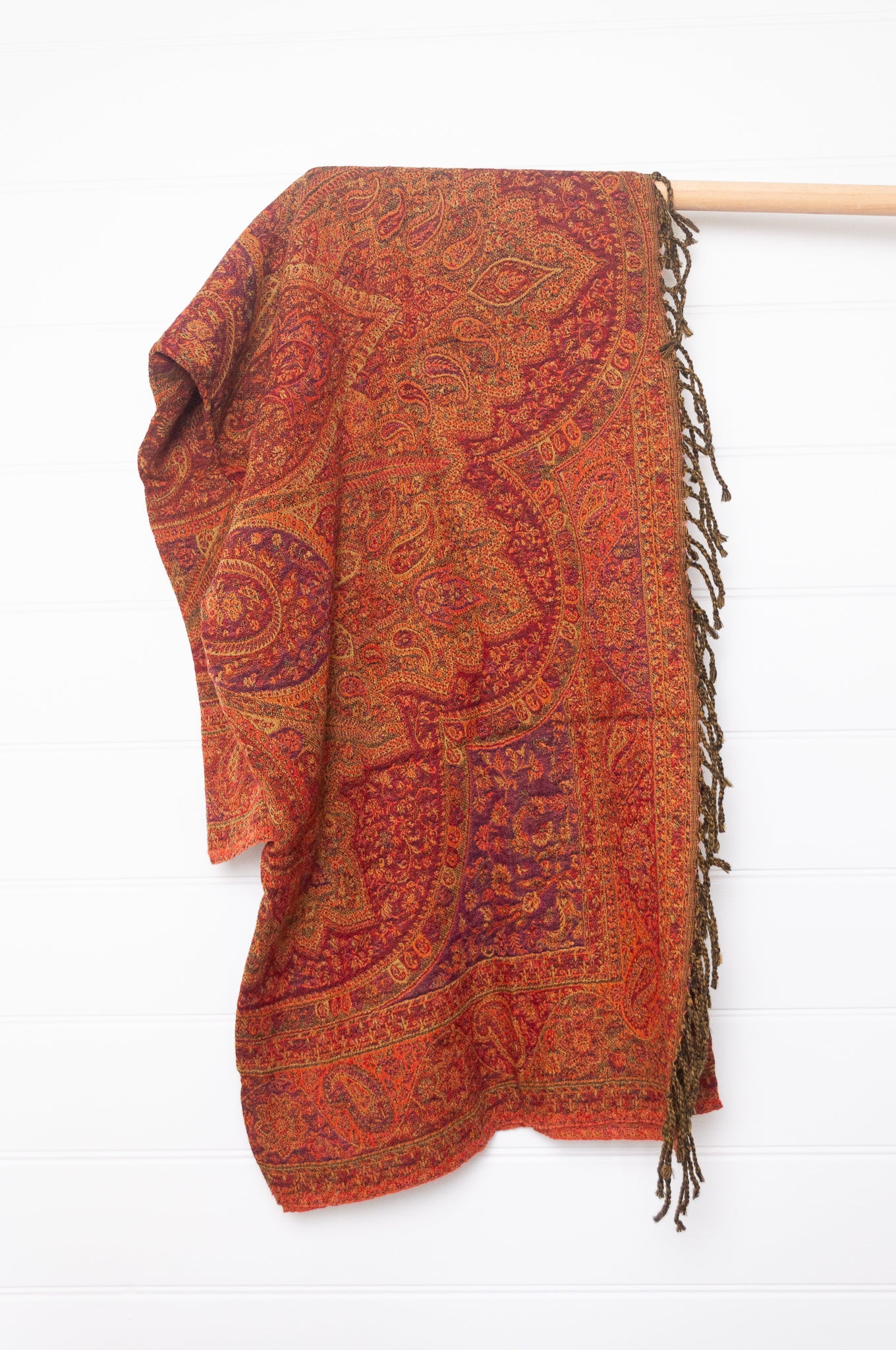 Tasseled wool throw - tamarind paisley
