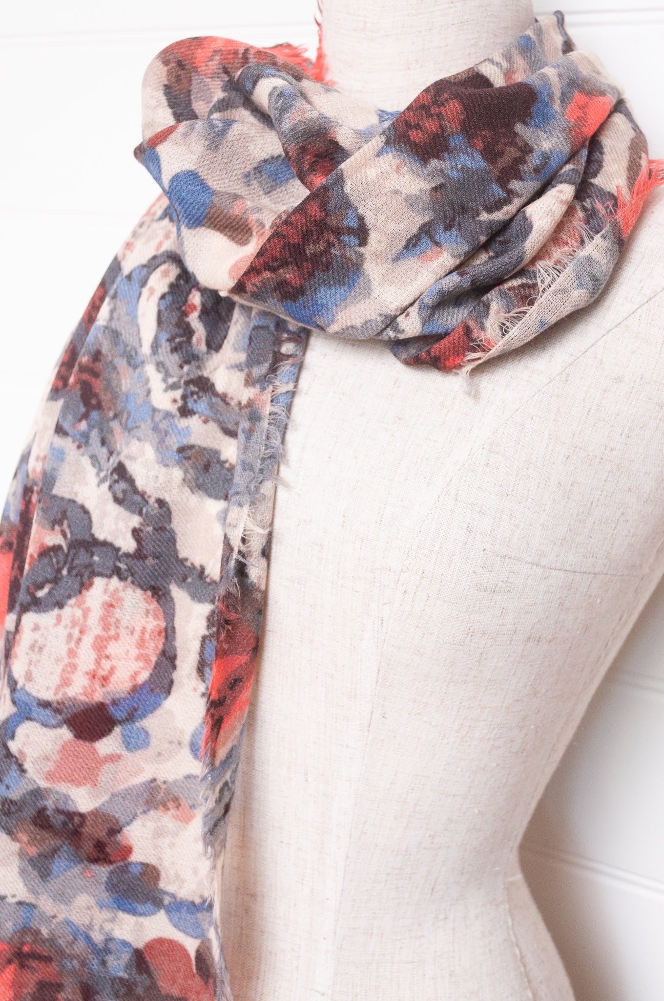 Colorful wool modal scarf with floral pattern on a white background