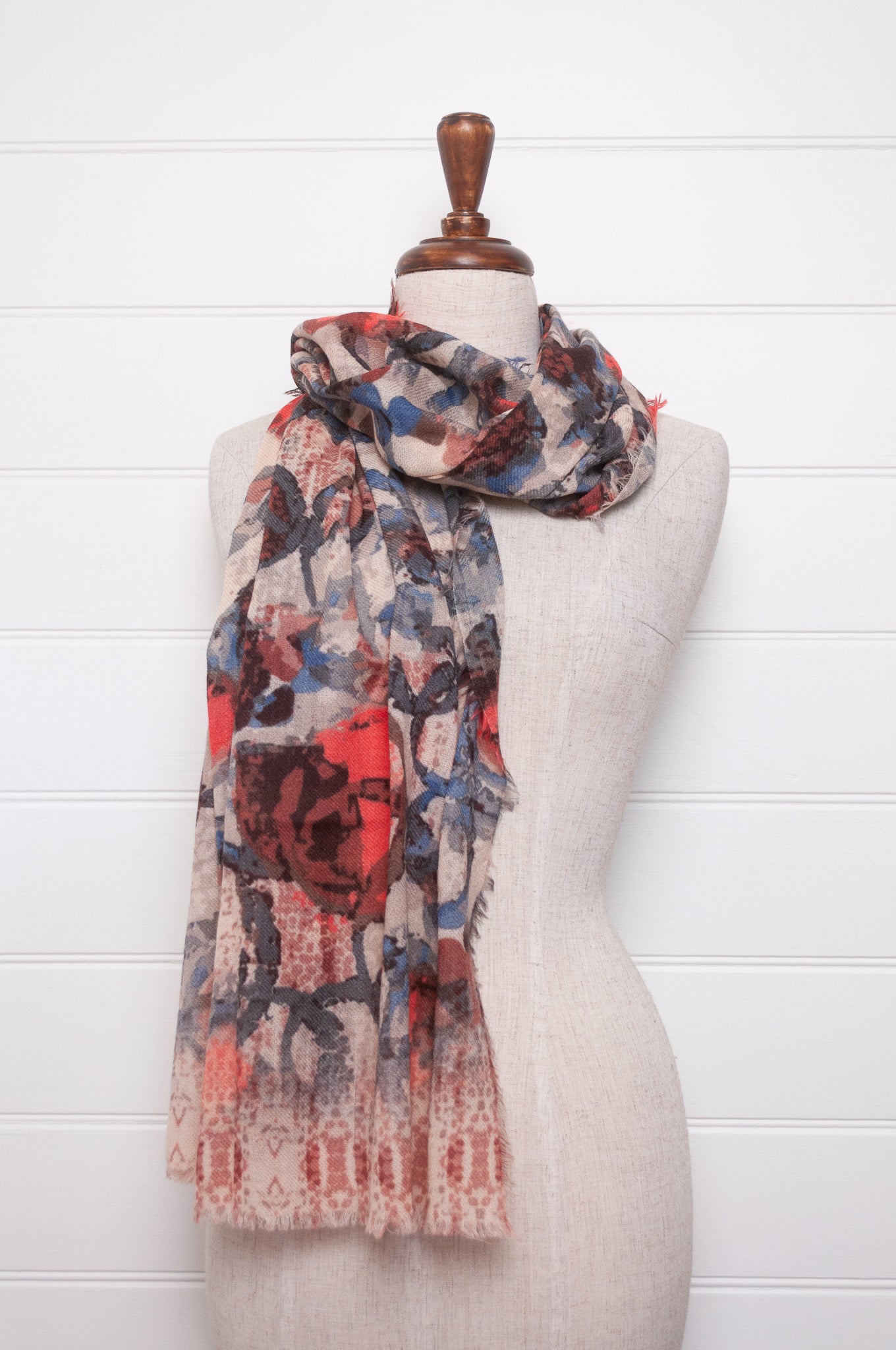 Colorful wool modal scarf with floral pattern on a white background