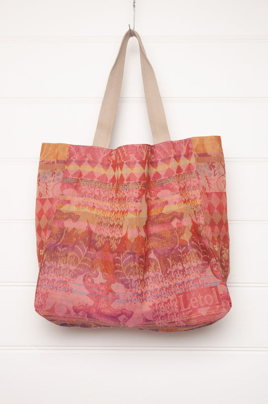 Letol organic cotton jacquard weave large tote bag in flowers in pink, orange and red.