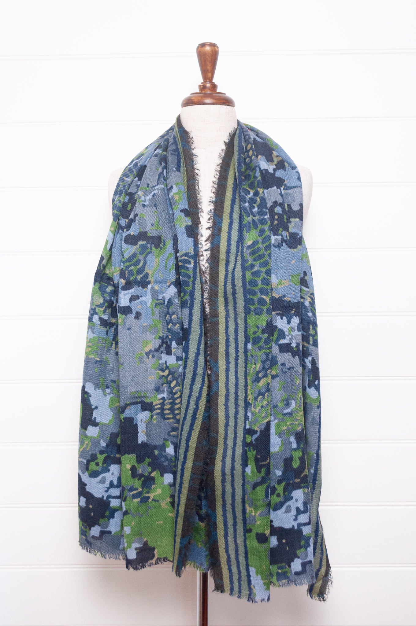 Fine wool modal scarf in bluel and green pixeallated camouflage print.