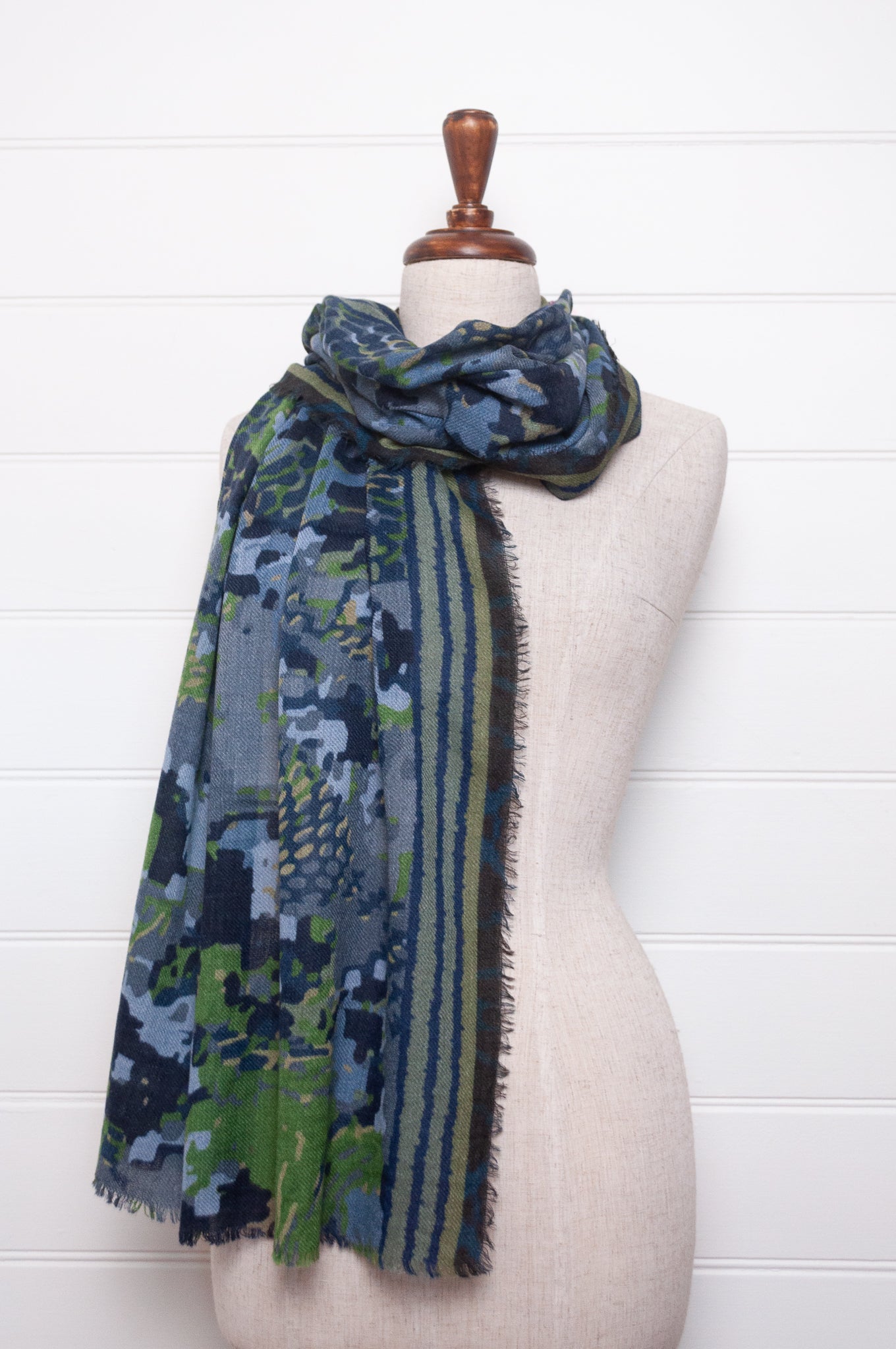 Fine wool modal scarf in bluel and green pixeallated camouflage print.