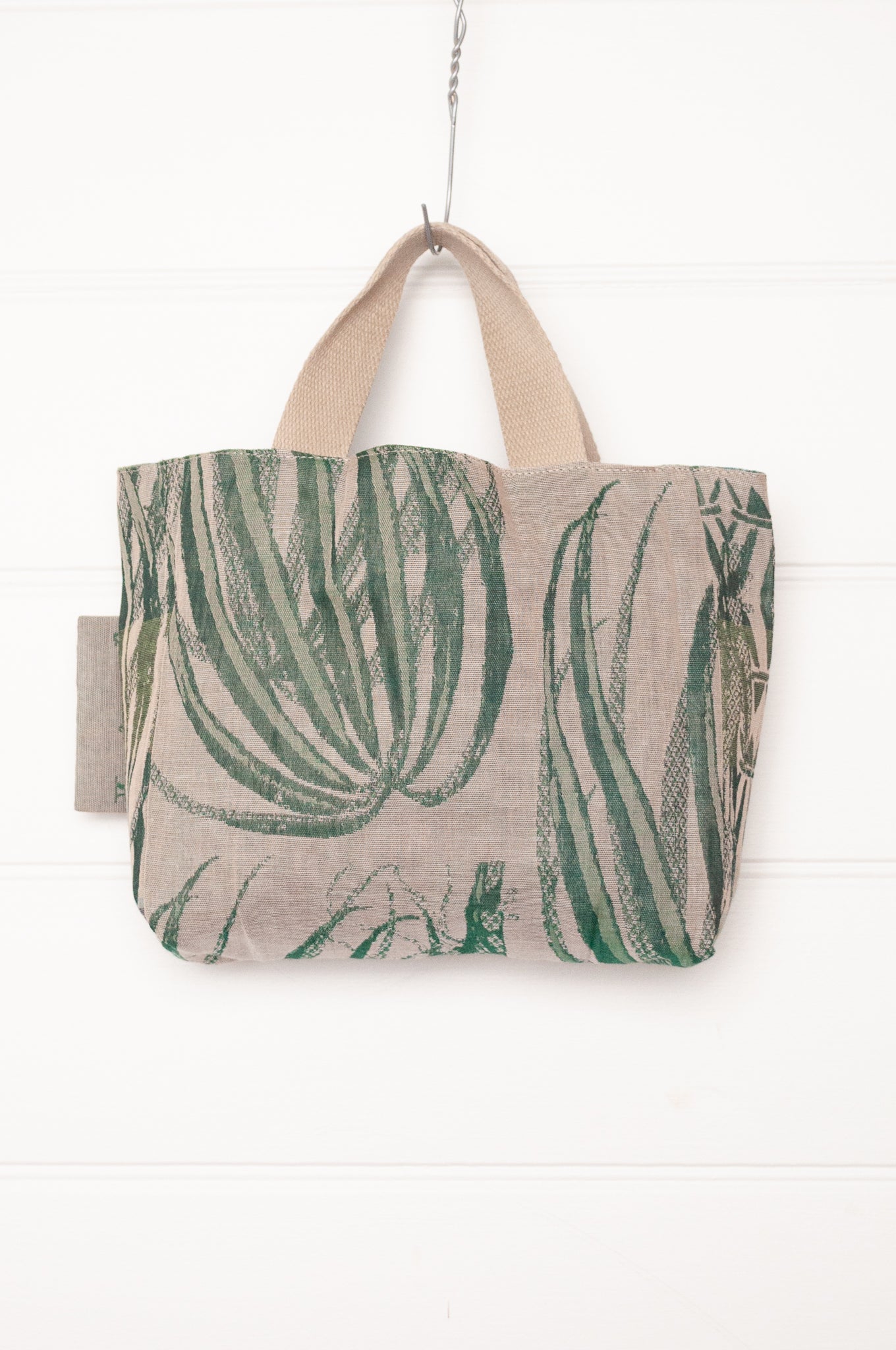 Letol organic cotton jacquard weave mini tote bag in flowers and foliage in greens and turquoise.