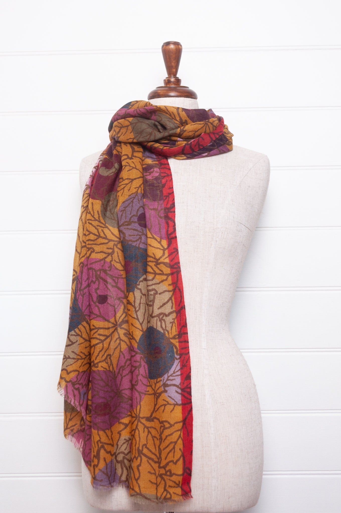 Fine wool modal scarf in autumn tones featuring berry print.