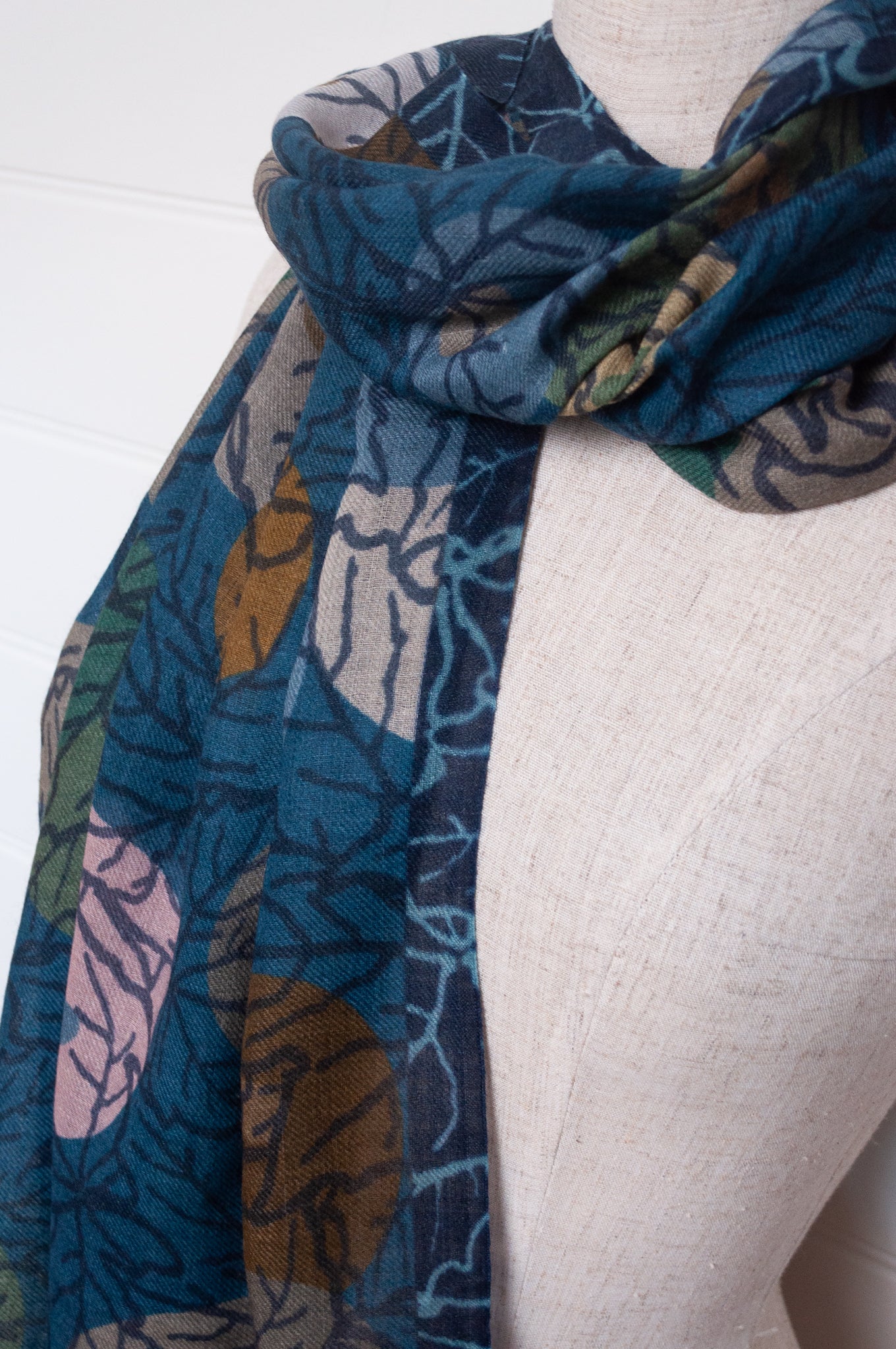 Fine wool modal scarf in winter tones featuring berry print.