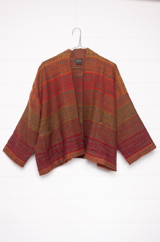 NK handwoven wool cropped kimono jacket in patterned stripes in autumn tones.