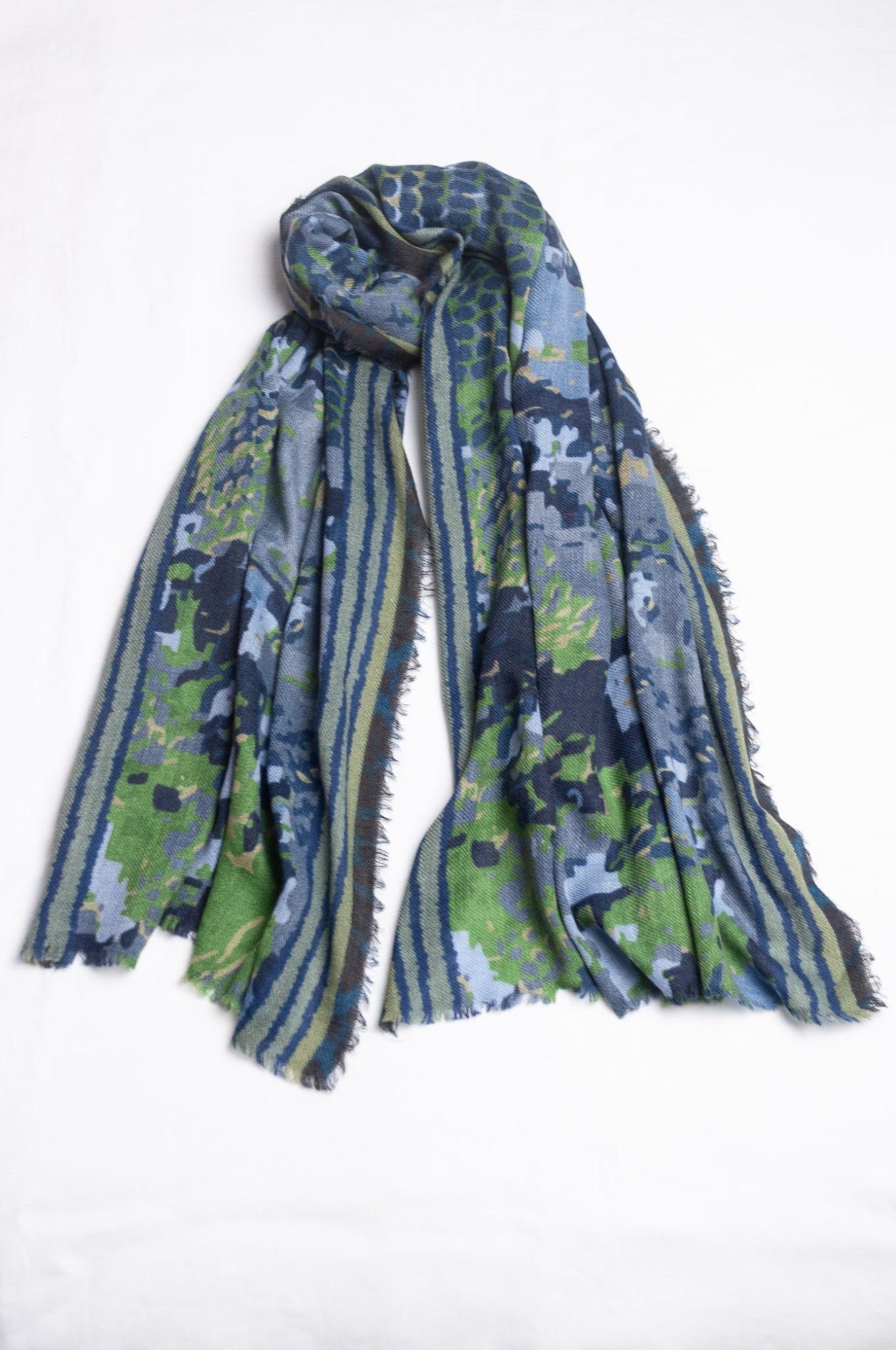 Fine wool modal scarf in bluel and green pixeallated camouflage print.