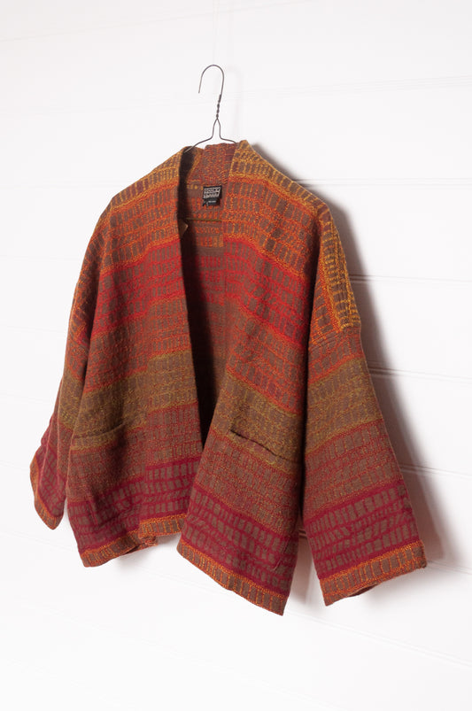 NK handwoven wool cropped kimono jacket in patterned stripes in autumn tones.
