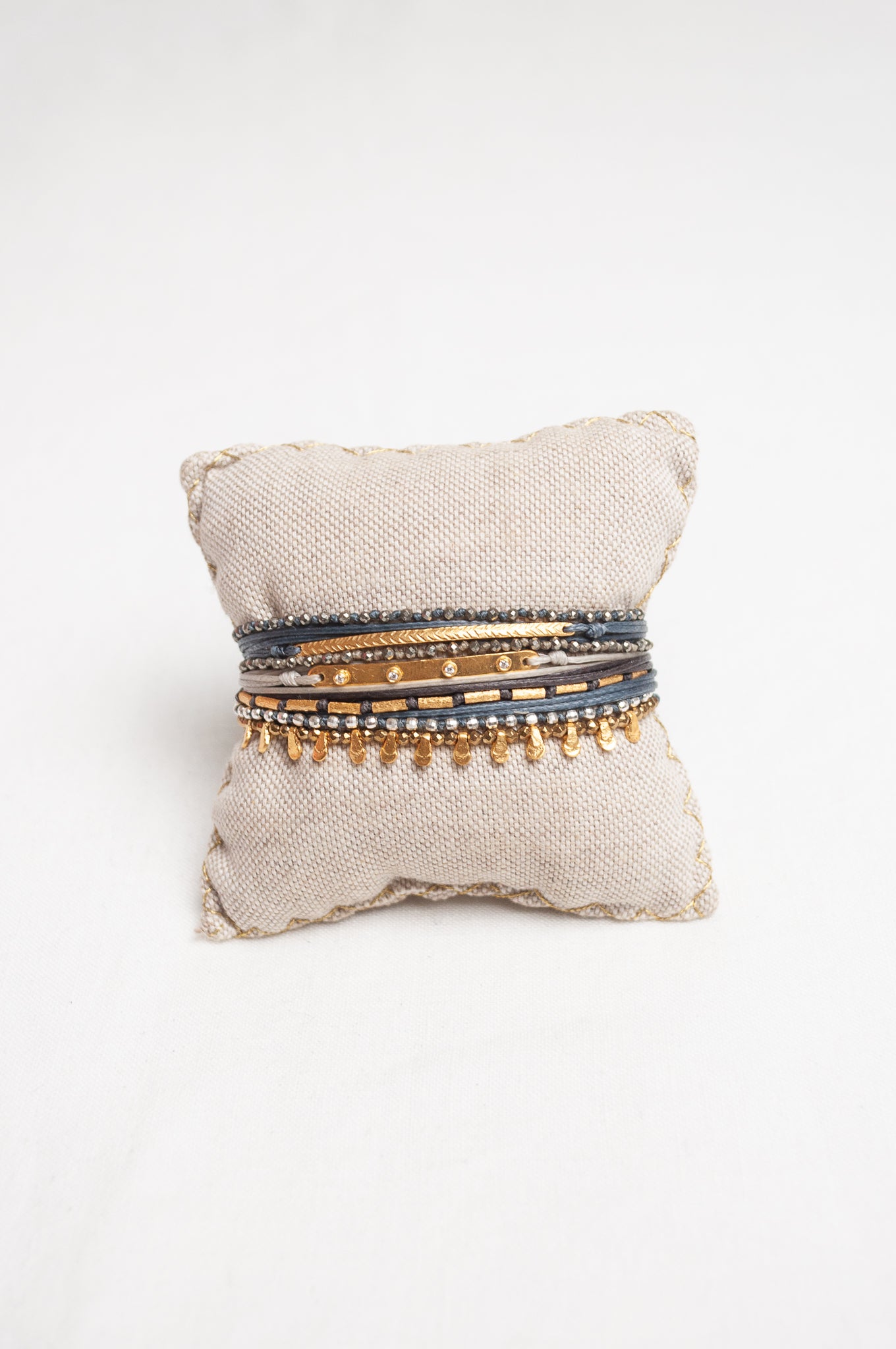 Mary Gaitani made in Greece waxed cord bracelet with gold charms and semi-precious stones.