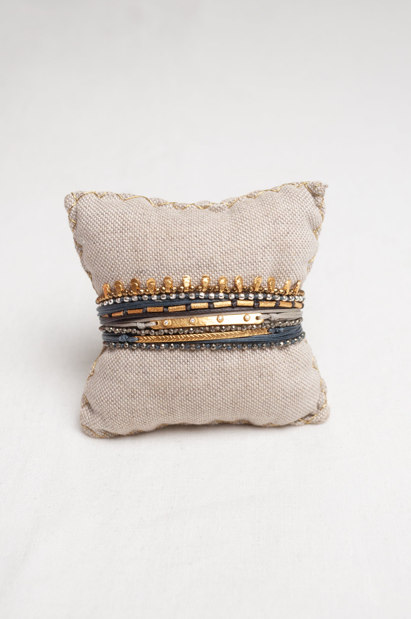 Mary Gaitani made in Greece waxed cord bracelet with gold charms and semi-precious stones.