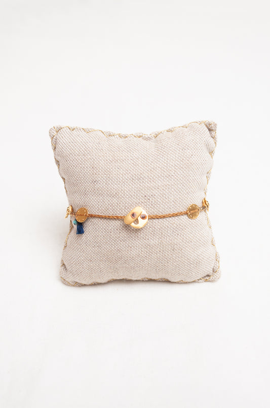 Mary Gaitani made in Greece waxed cord bracelet with gold charms and tiny tassel.
