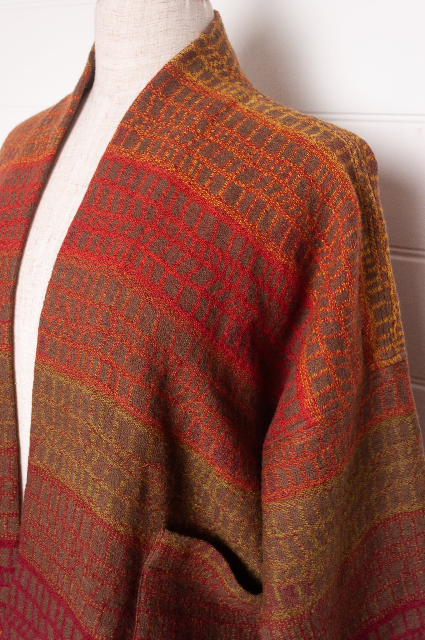 NK handwoven wool cropped kimono jacket in patterned stripes in autumn tones.