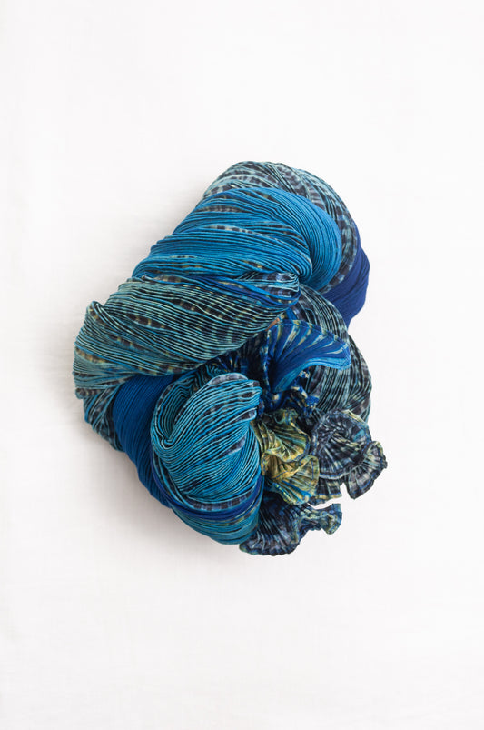 Neeru Kumar crinkle silk shibori scarf in cobalt blue and turquoise with a speckled print.