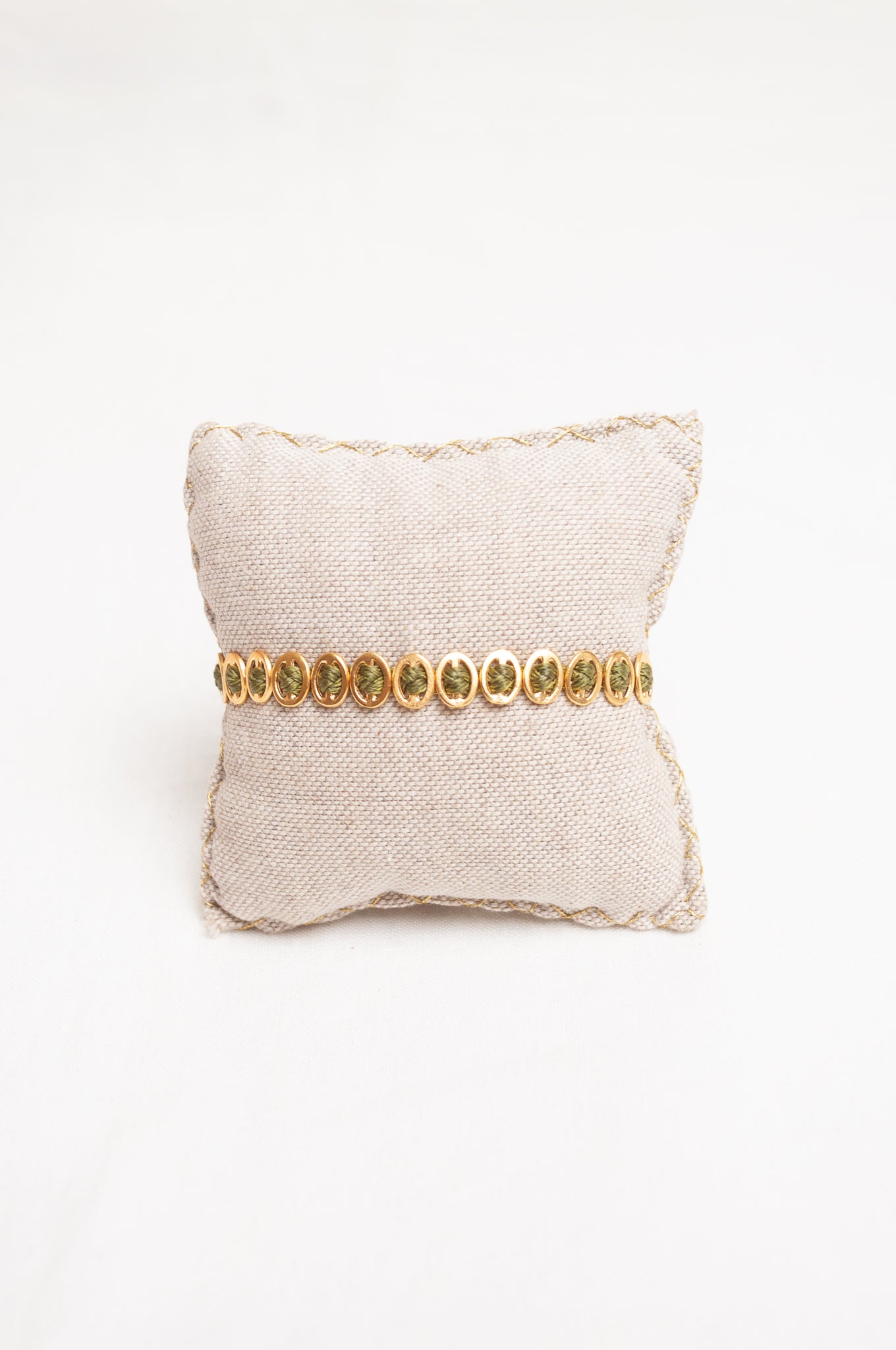Mary Gaitani made in Greece plaited waxed cord bracelet with gold buckle charms.