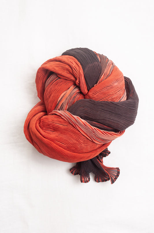 Neeru Kumar crinkle silk shibori scarf in pomegranate shades of red.