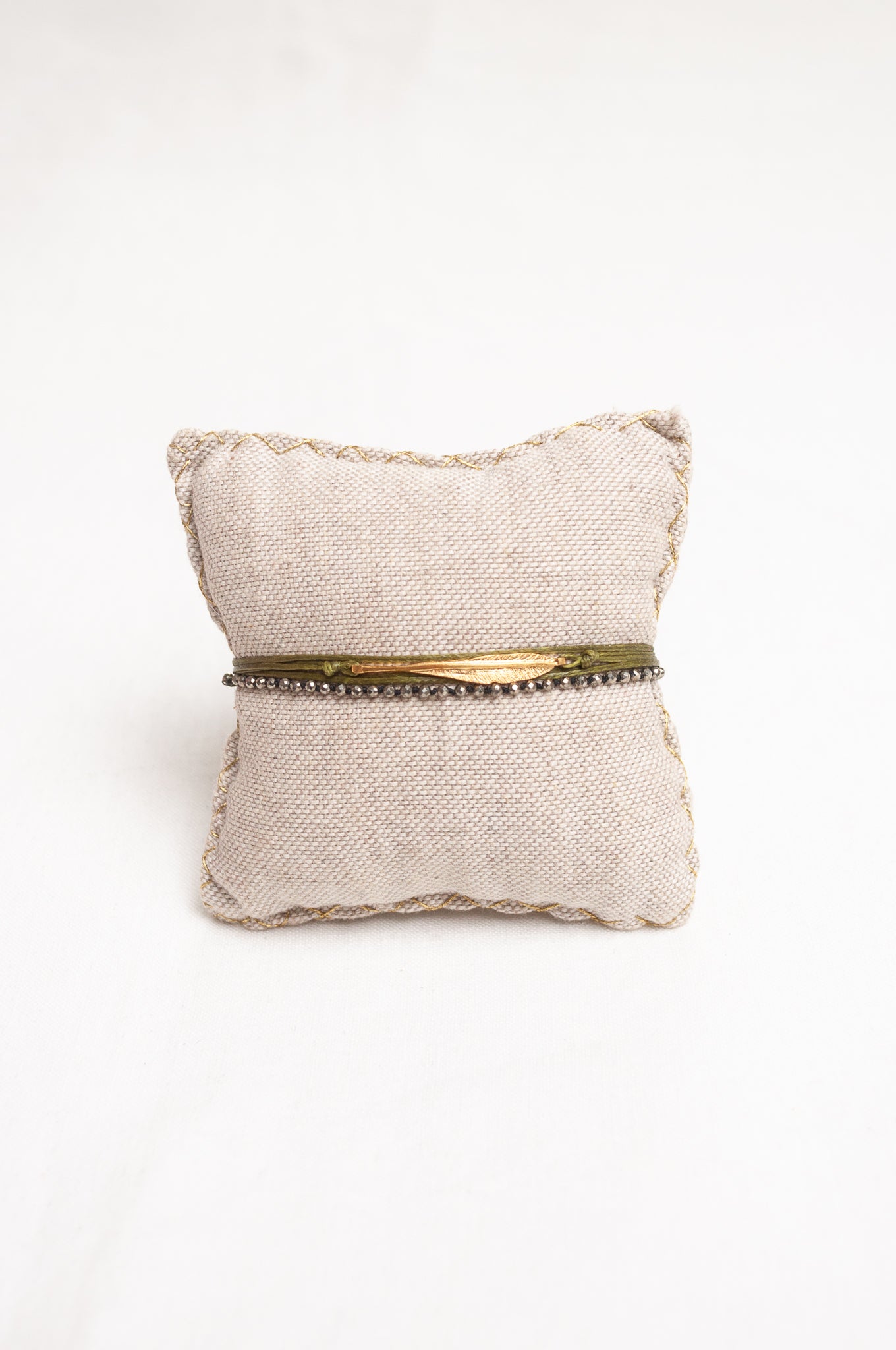 Mary Gaitani made in Greece waxed cord bracelet with gold feather charm, and semi-precious stones.