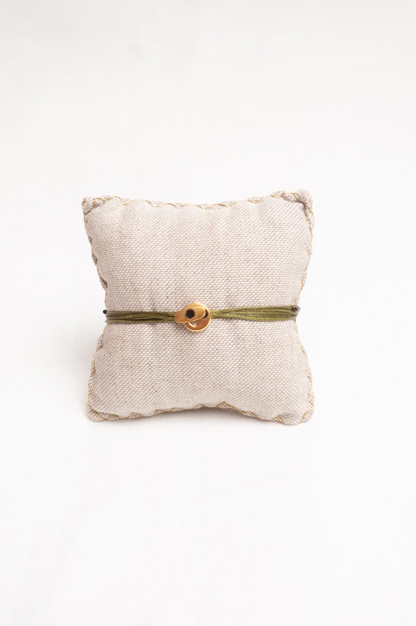 Mary Gaitani made in Greece waxed cord bracelet with gold feather charm, and semi-precious stones.
