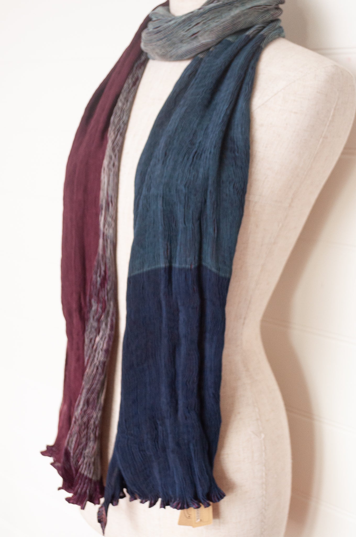 Neeru Kumar crinkle silk shibori scarf in burgundy and teal.
