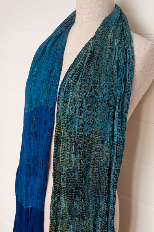 Neeru Kumar crinkle silk shibori scarf in cobalt blue and turquoise with a speckled print.