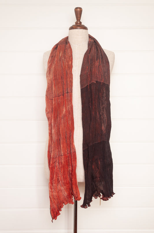 Neeru Kumar crinkle silk shibori scarf in pomegranate shades of red.