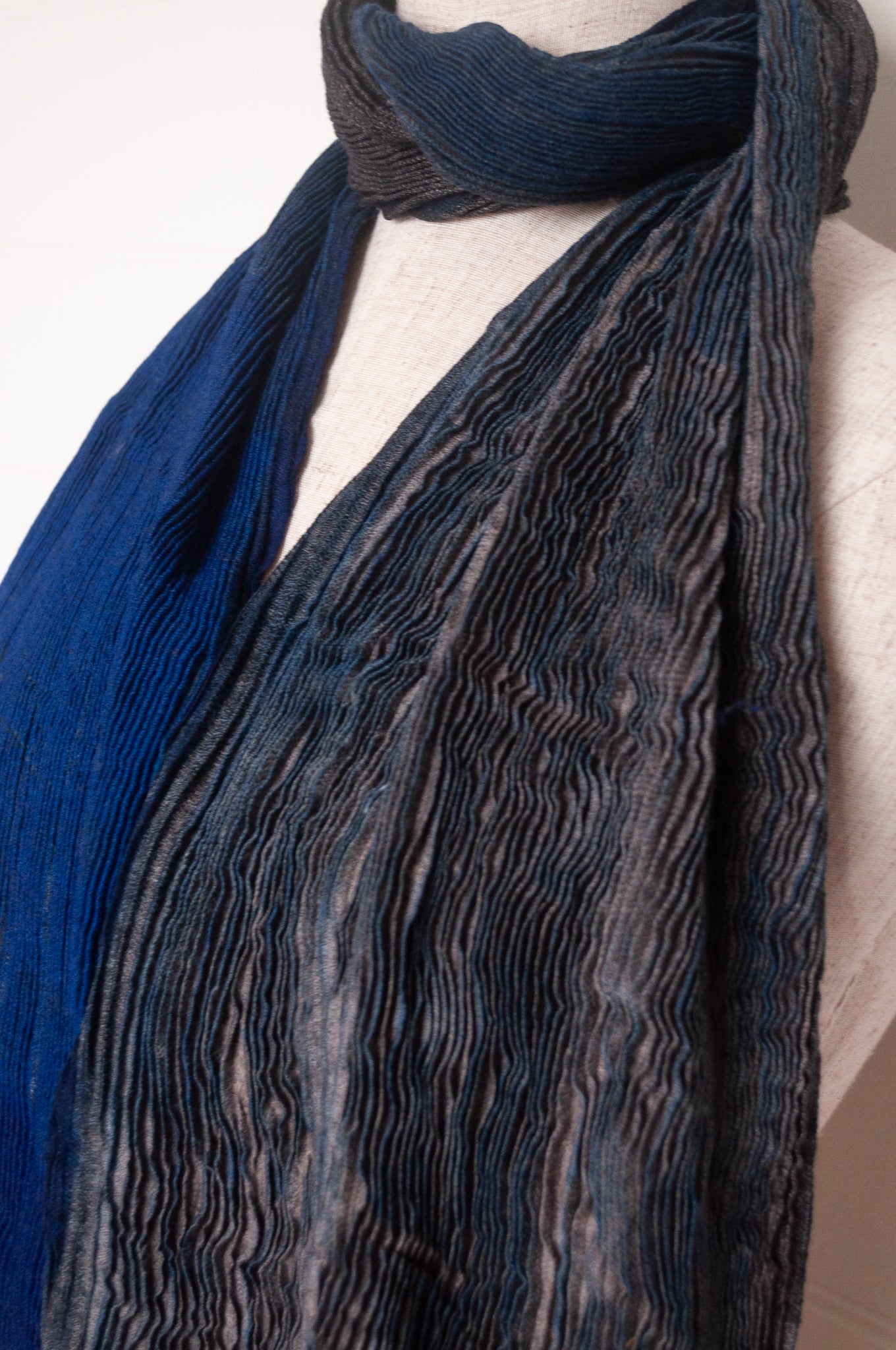 NK Shibori dyed wool scarf in cobalt blue and charocal, pleat finish.
