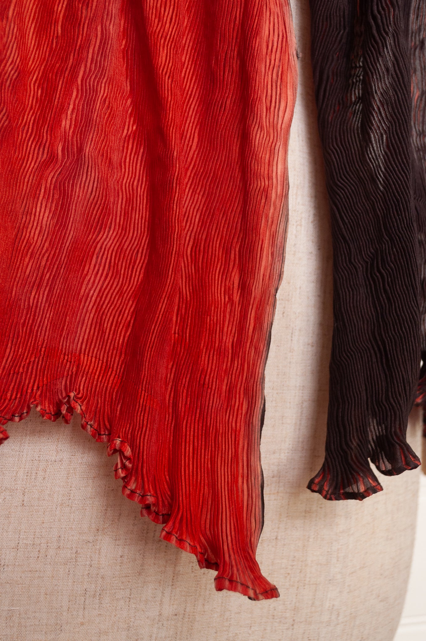 Neeru Kumar crinkle silk shibori scarf in pomegranate shades of red.