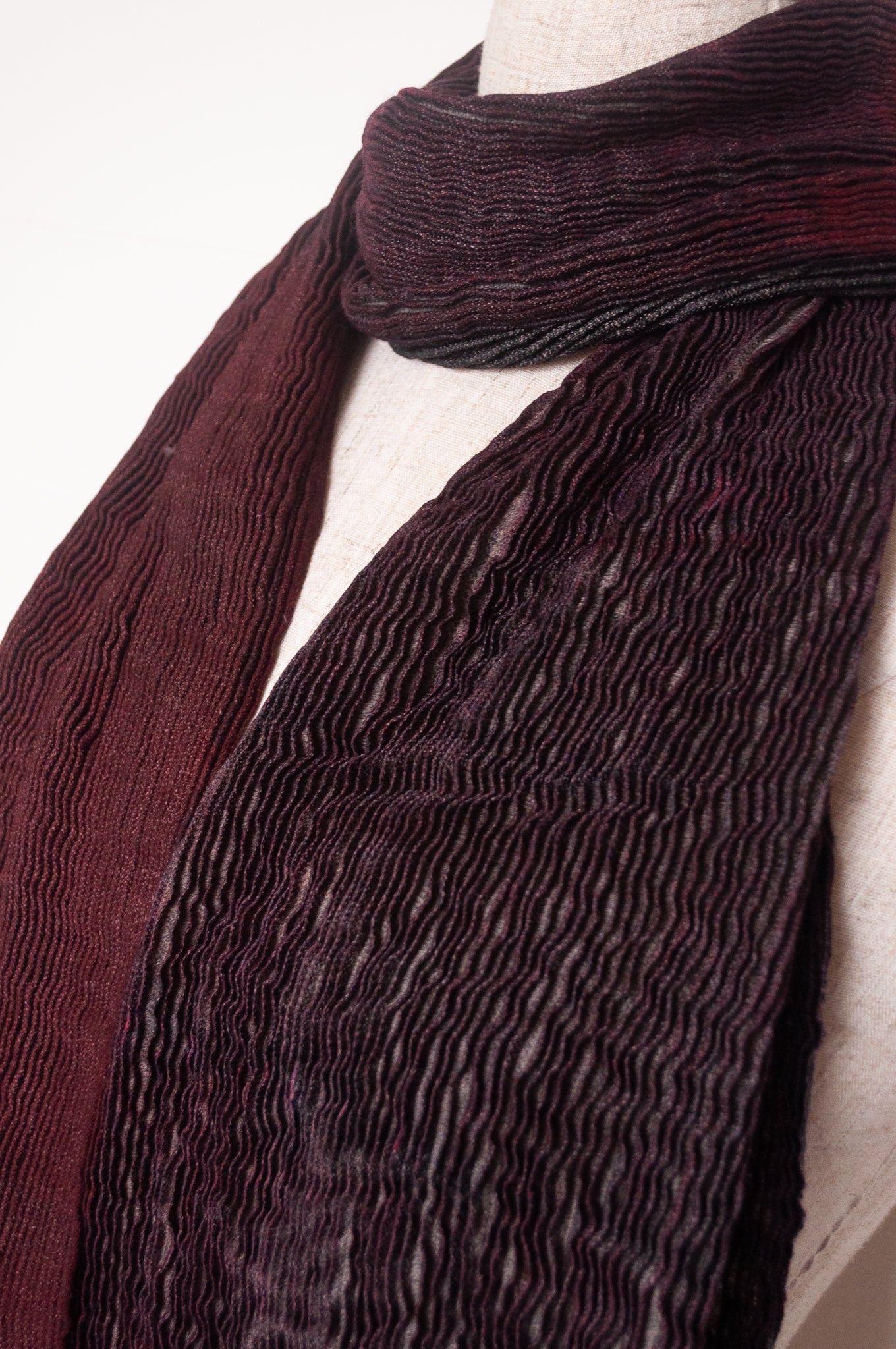 NK Shibori dyed wool scarf in wine red and charocal, pleat finish.