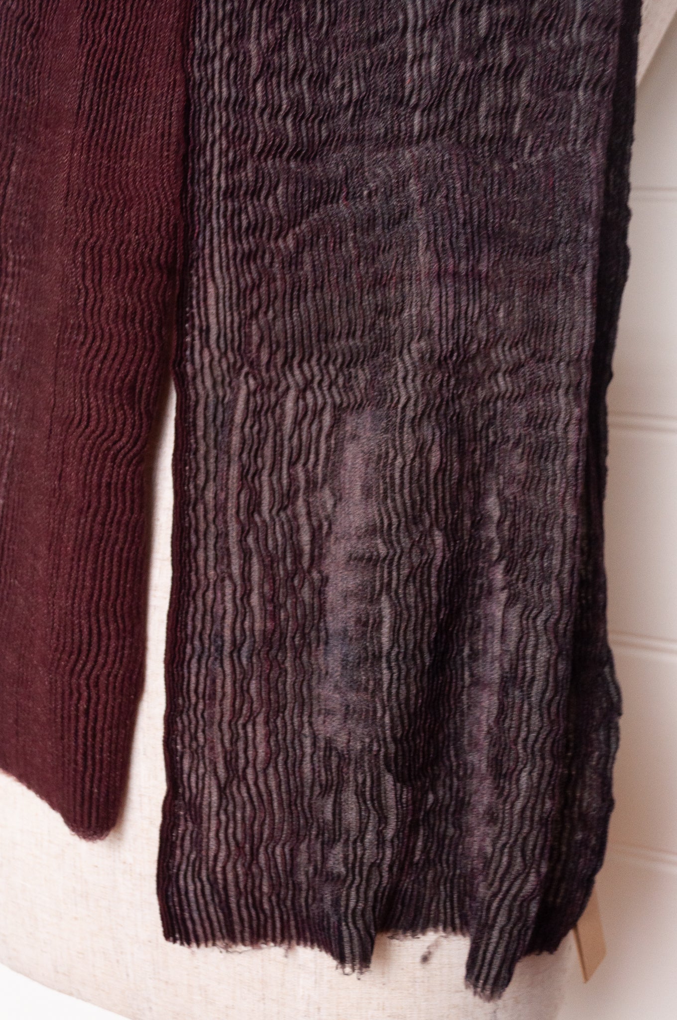 NK Shibori dyed wool scarf in wine red and charocal, pleat finish.