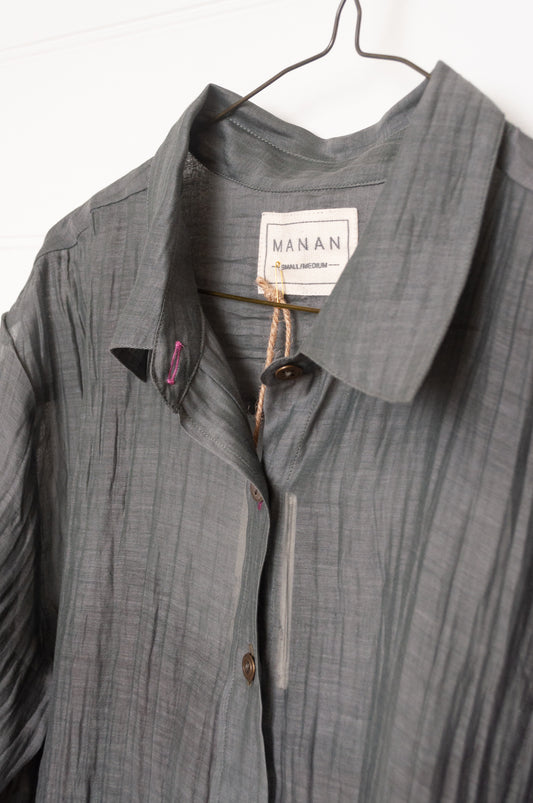 Manan cotton silk longline button up shirt in pewter grey with brown silk camisole.