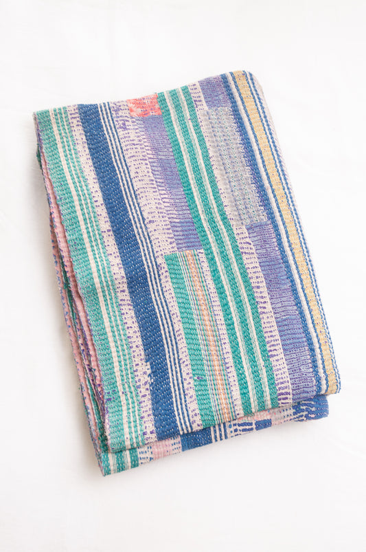 Vintage kantha quilt in deep pink, bluel lavender and green stripes.
