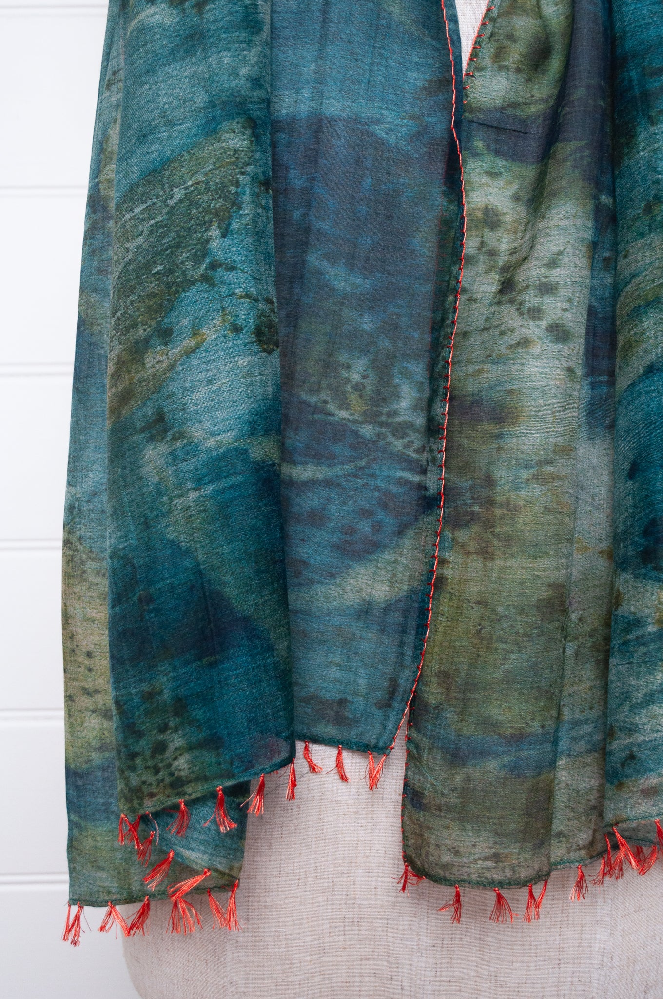 Neeru Kumar cotton silk scarf in blue and green with embroidered edging and tiny tassels.