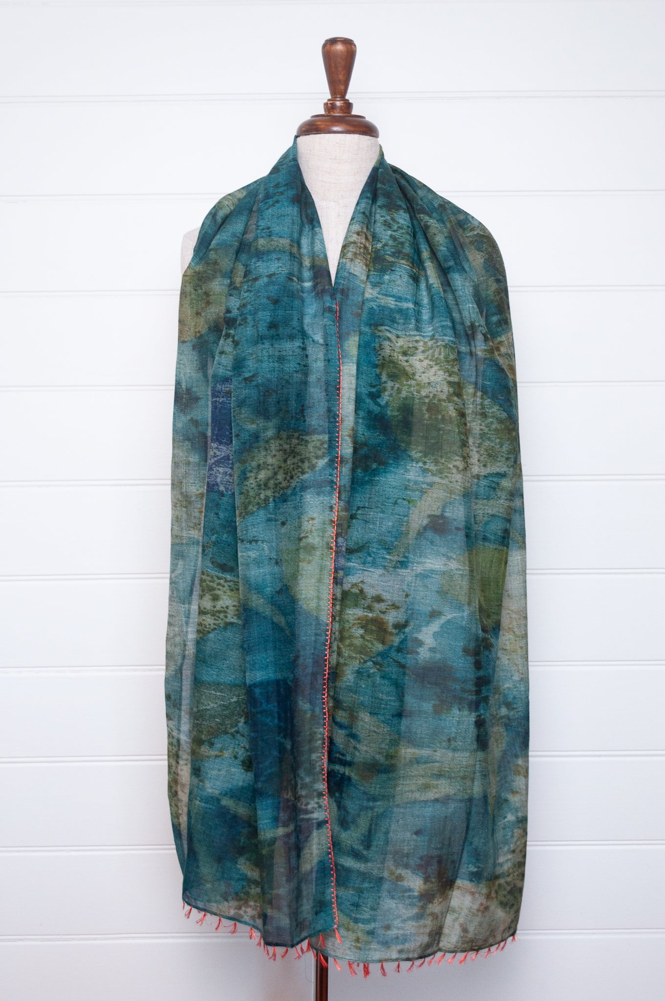 Neeru Kumar cotton silk scarf in blue and green with embroidered edging and tiny tassels.