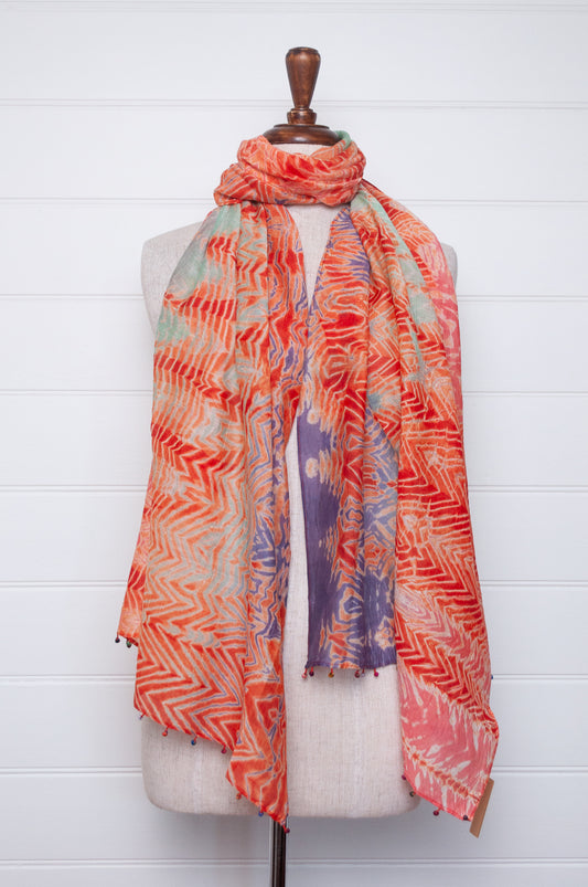 Neeru Kumar shibori dyed cotton silk scarf in orange with fabric beads.