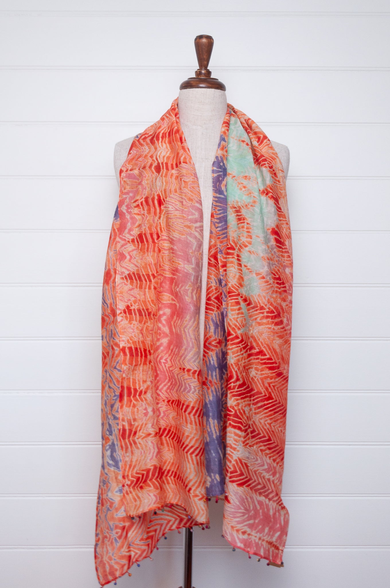 Neeru Kumar shibori dyed cotton silk scarf in orange with fabric beads.